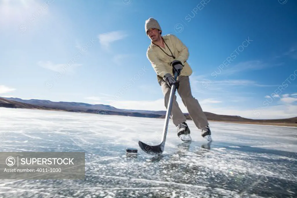 USA, Colorado, Ice skating at Blue Mesa Reservoir