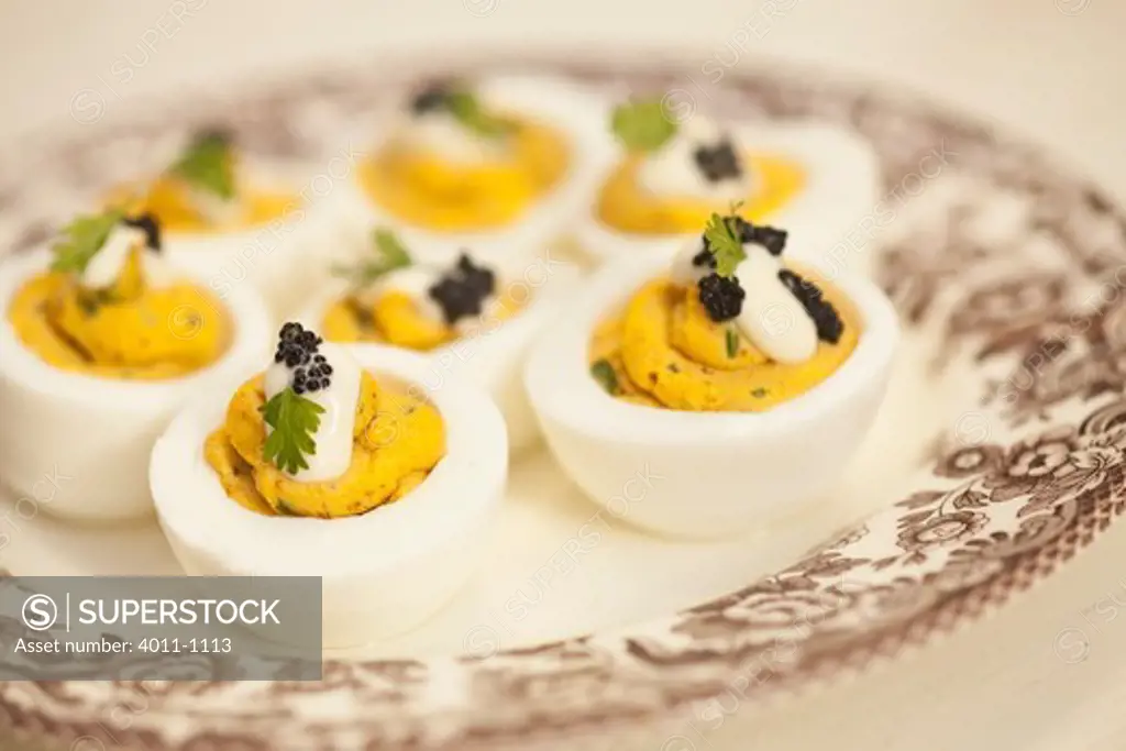 Deviled Eggs with cream cheese and dab of caviar