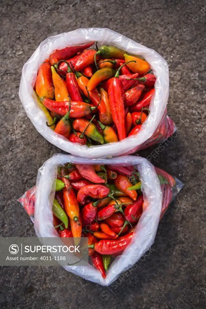 Sweet red peppers in plastic bags for sale, Costa Rica