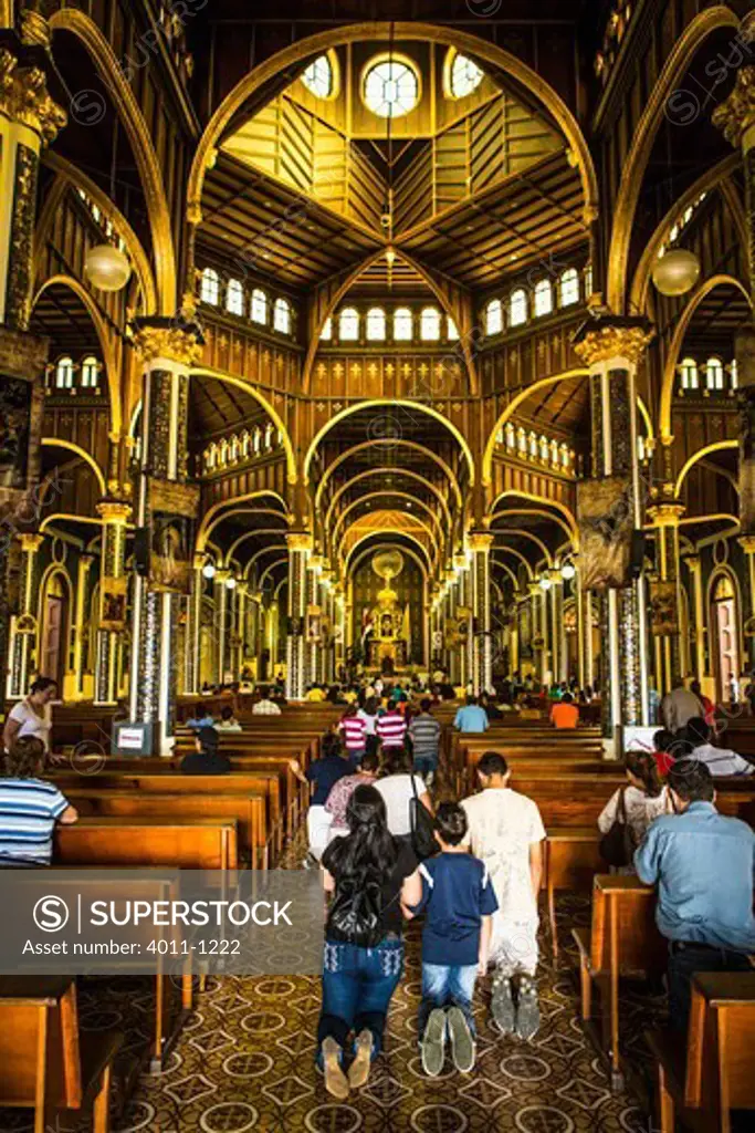 Worshipers praying at the Basilica Nuestra Senora De Los Angeles, Cartago, Costa Rica