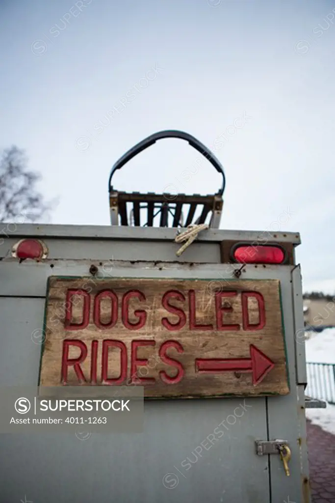 Dog Sled Rides Sign on back of Dog Truck