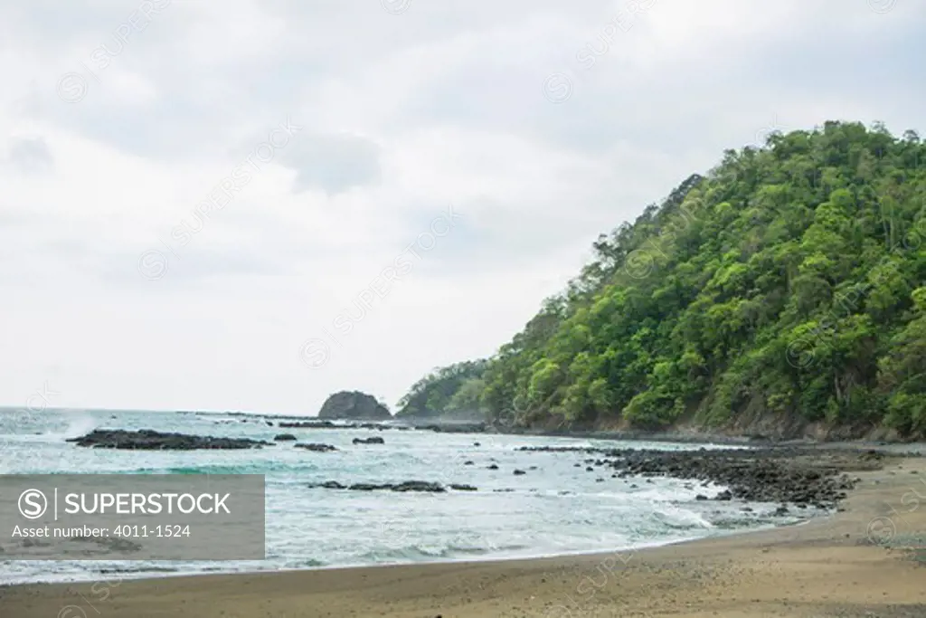 Costa Rica, Bay with rain forest down to beach