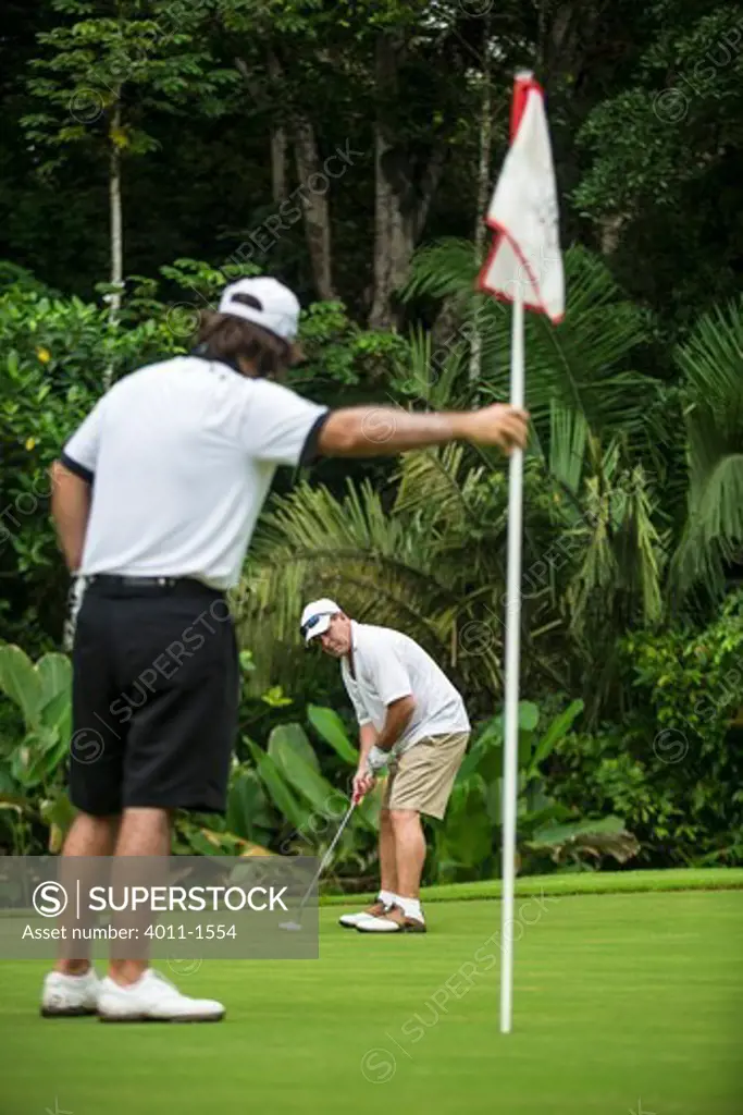 Costa Rica, Two men playing golf