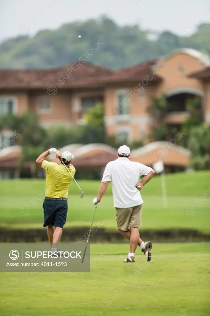 Costa Rica, Two Golfers teeing off over water