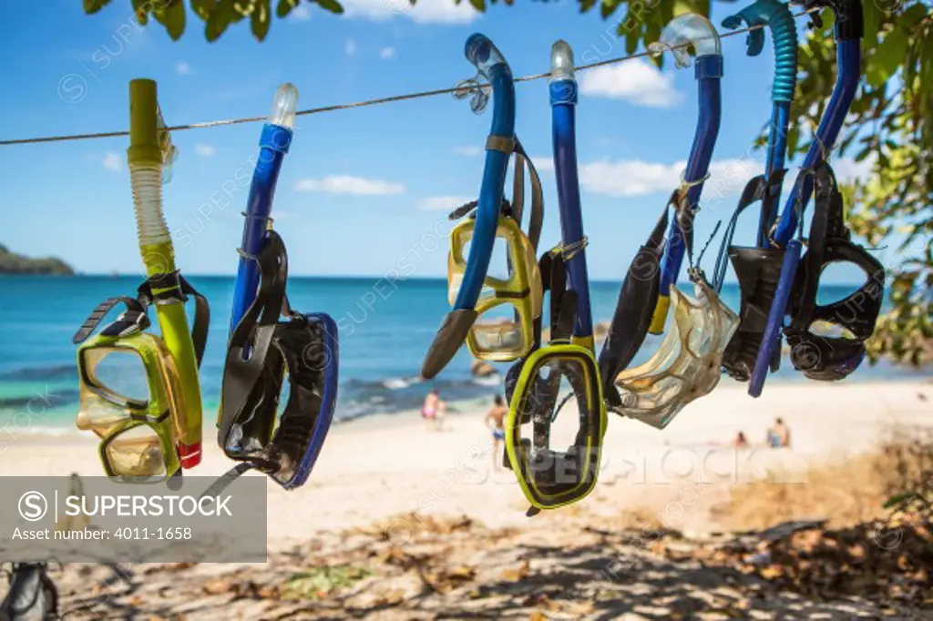 Costa Rica, Tamarindo, Snorkels hanging on beach