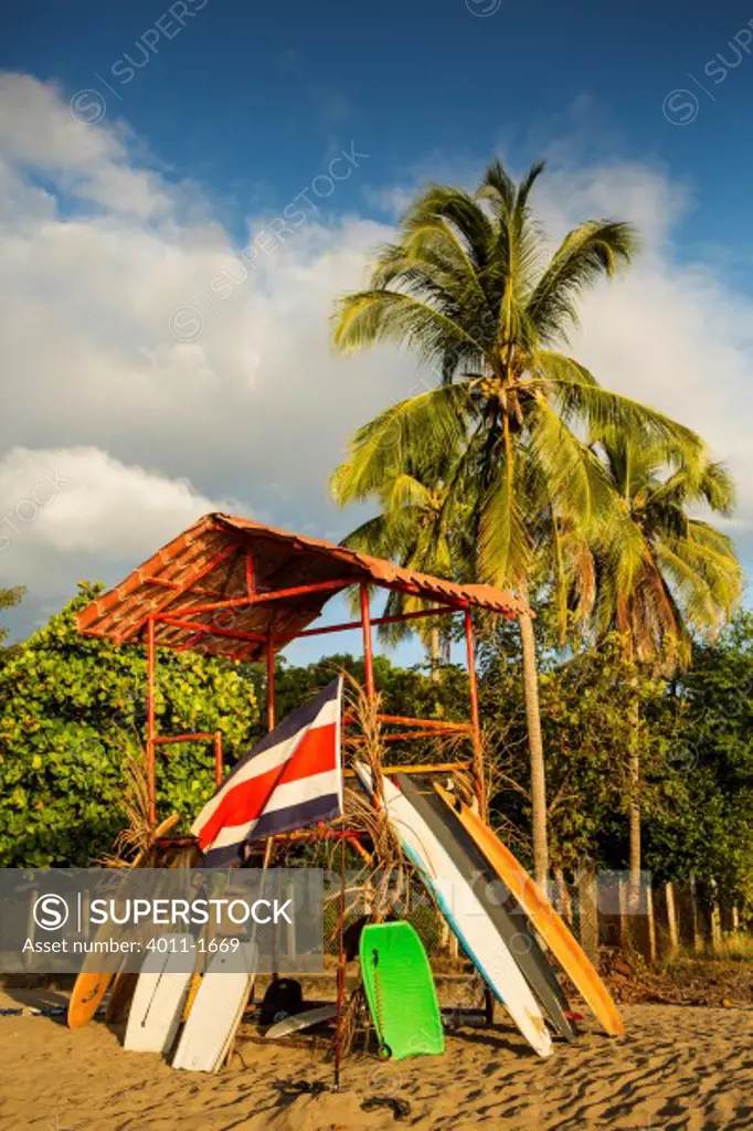 Costa Rica, Tamarindo, Surfboard and boogie board rental hut on beach