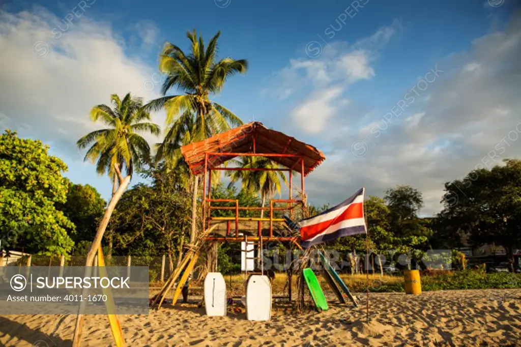 Costa Rica, Tamarindo, Surfboard and boogie board rental hut on beach