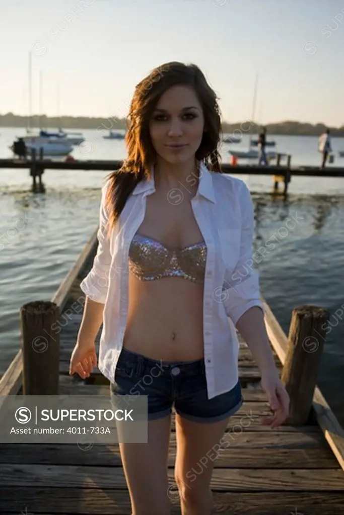 USA, Texas, Dallas, Portrait of teenage girl on pier at White Rock Lake