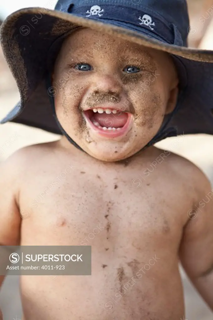 Close-up of a baby boy smiling on the beach, Puerto Vallarta, Jalisco State, Mexico