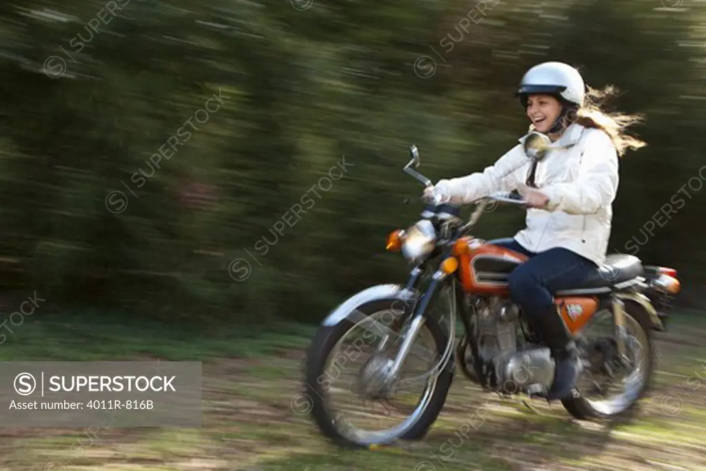 Teenage girl riding motorcycle
