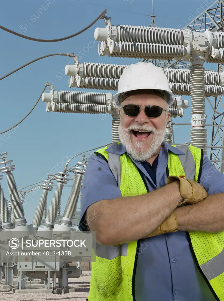 Engineer smiling with his arms crossed