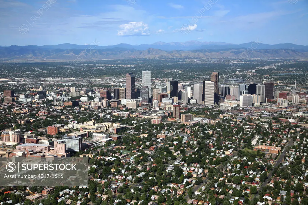 Aerial of City Park West and Curtis Park - Five Points Districts with Uptown and Downtown Denver behind them