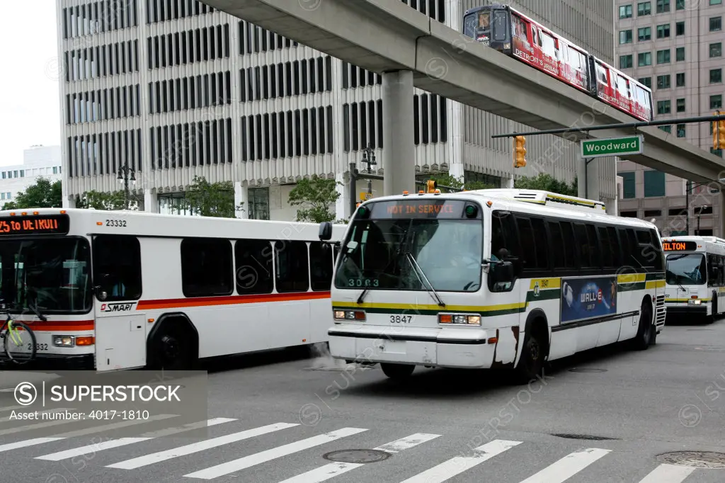City Transit buses and the Detroit People Mover in Downtown Detroit, Michigan