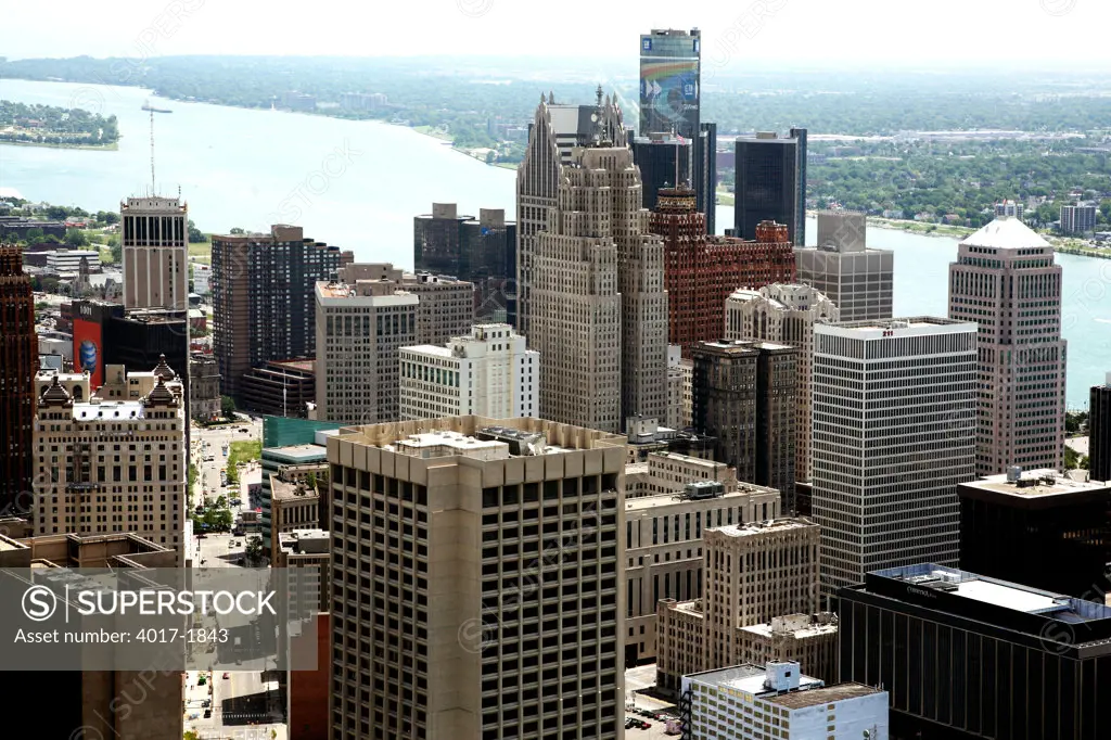 Aerial of Detroit, MI Skyline from Downtown with Canada in Background across the River
