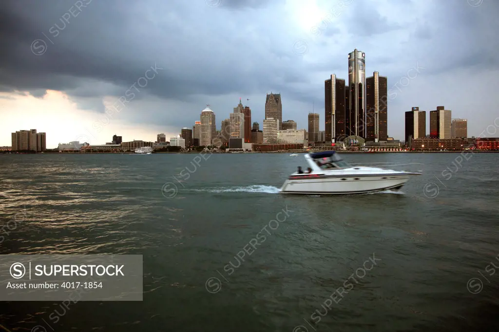 Downtown Detroit Skyline at Dusk from the Detroit River with a boat in the Foreground