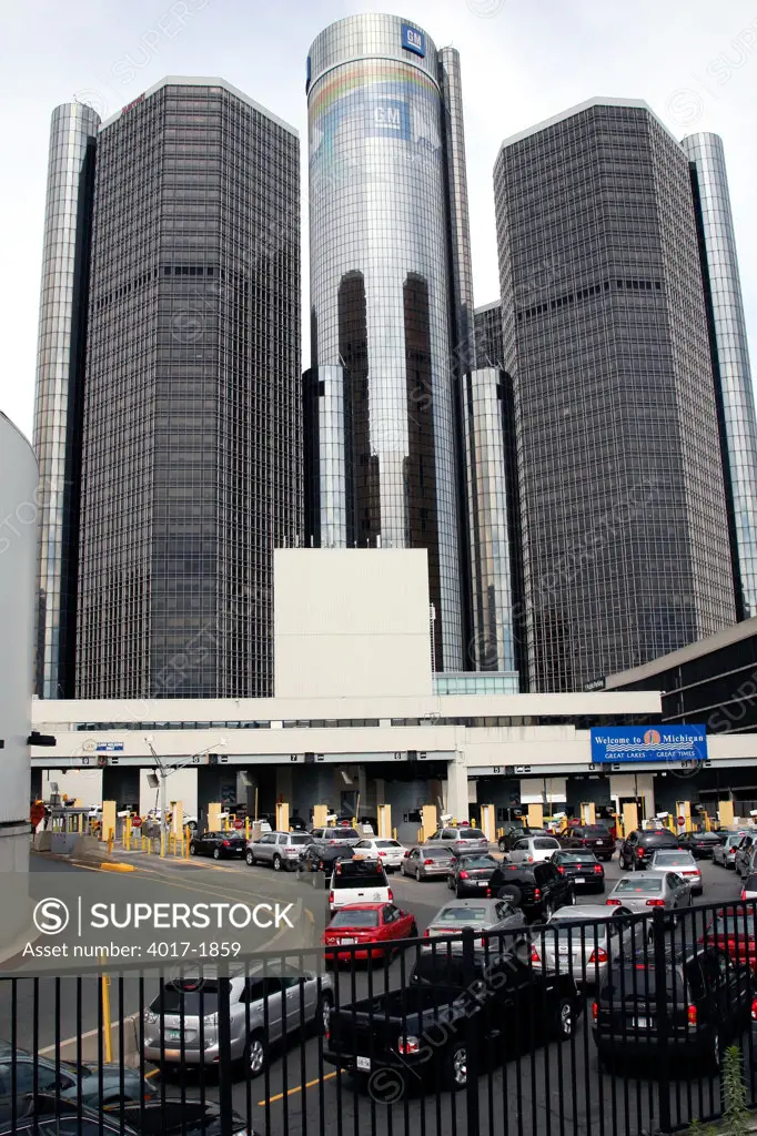 Toll Plaza to Enter Tunnel to Windsor Candada in downtown Detroit  with the GM Headquarters Building towering over in the Background