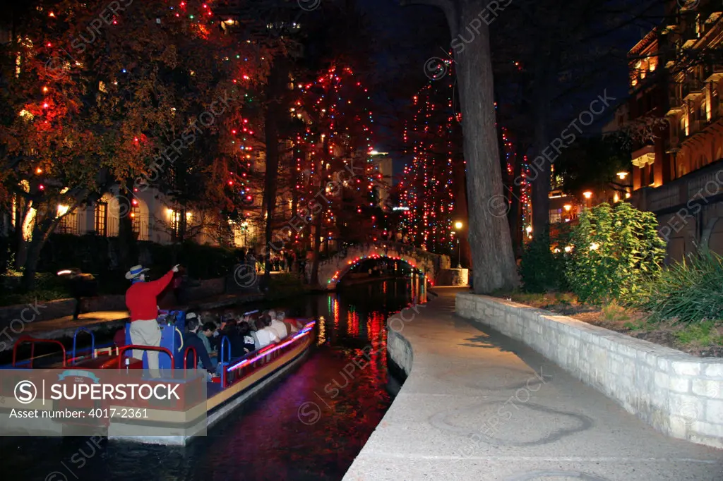 Rio San Antonio Cruises River Tour Boats on the Riverwalk on the San Antonio River at Night