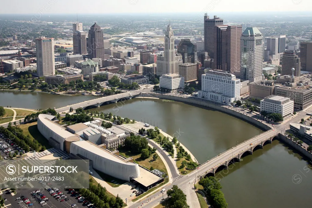 Aerial view of COSI Columbus along the Scioto River with the downtown skyline of Columbus, Ohio, USA