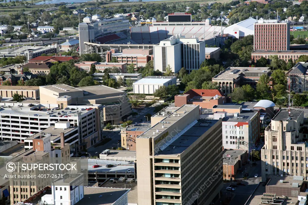 Aerial view of buildings in a city, Memorial Stadium, Lincoln, Lancaster County, Nebraska, USA