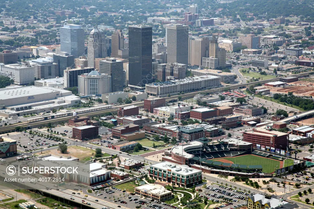 Aerial view of downtown Oklahoma City skyline with RedHawks Field at Bricktown stadium in foreground, Oklahoma, USA