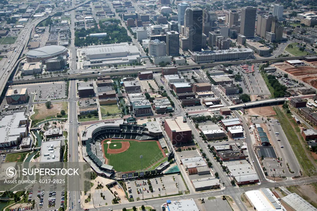 Aerial view of Oklahoma city skyline with RedHawks Field at Bricktown stadium in foreground, Oklahoma, USA