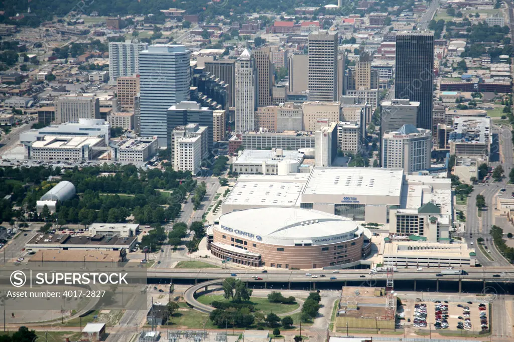 Aerial view of downtown Oklahoma City skyline with Ford Center Arena in foreground, Oklahoma, USA