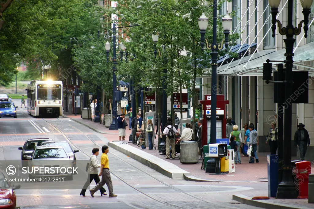 Pedestrians near max light rail line in downtown Portland, Oregon, USA