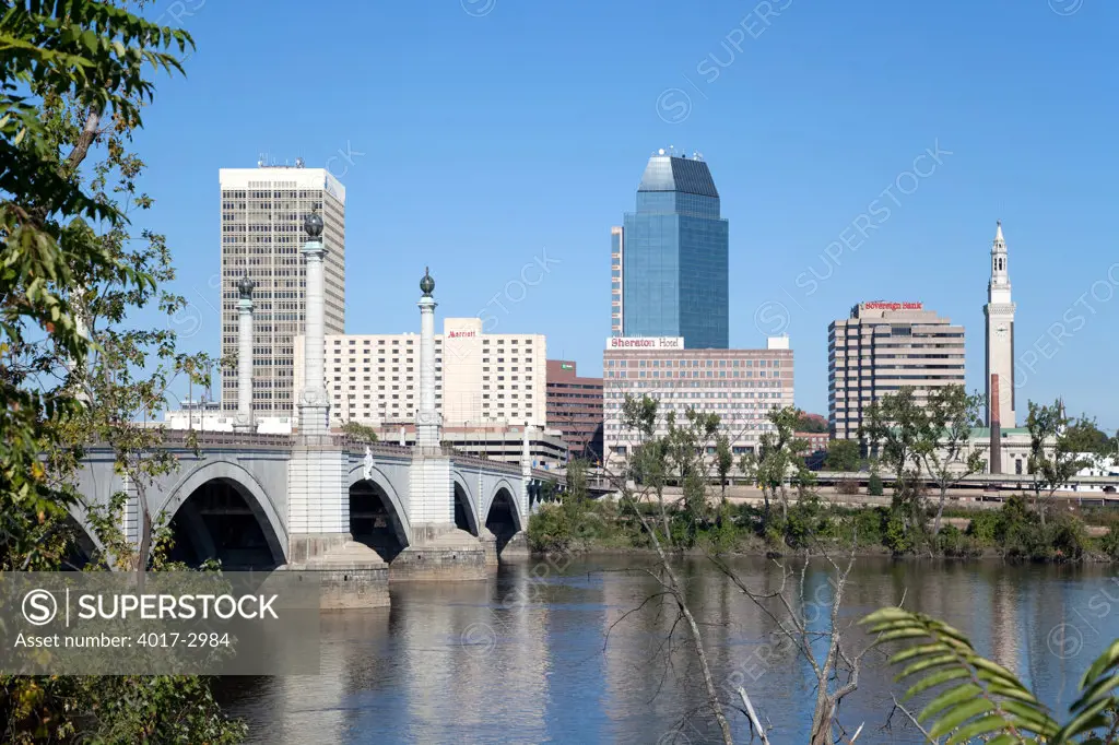 Downtown skyline of Springfield, Massachusetts from across the Connecticut River with the Springfield Memorial Bridge, USA