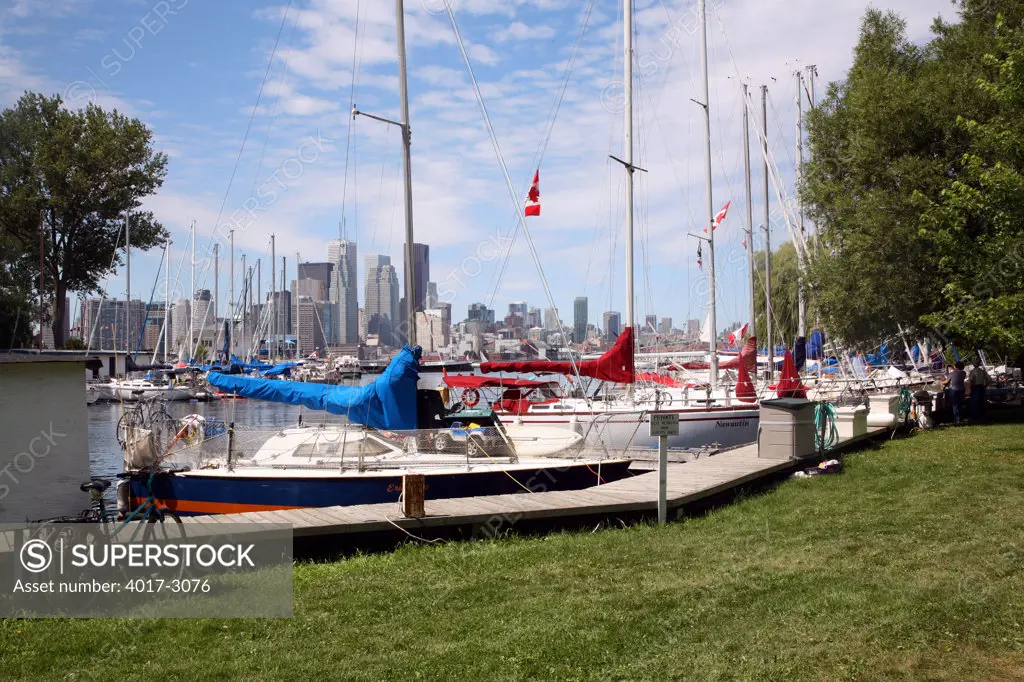 Sailboats at dock with skylines in the background, Toronto Island, Lake Ontario, Toronto, Ontario, Canada