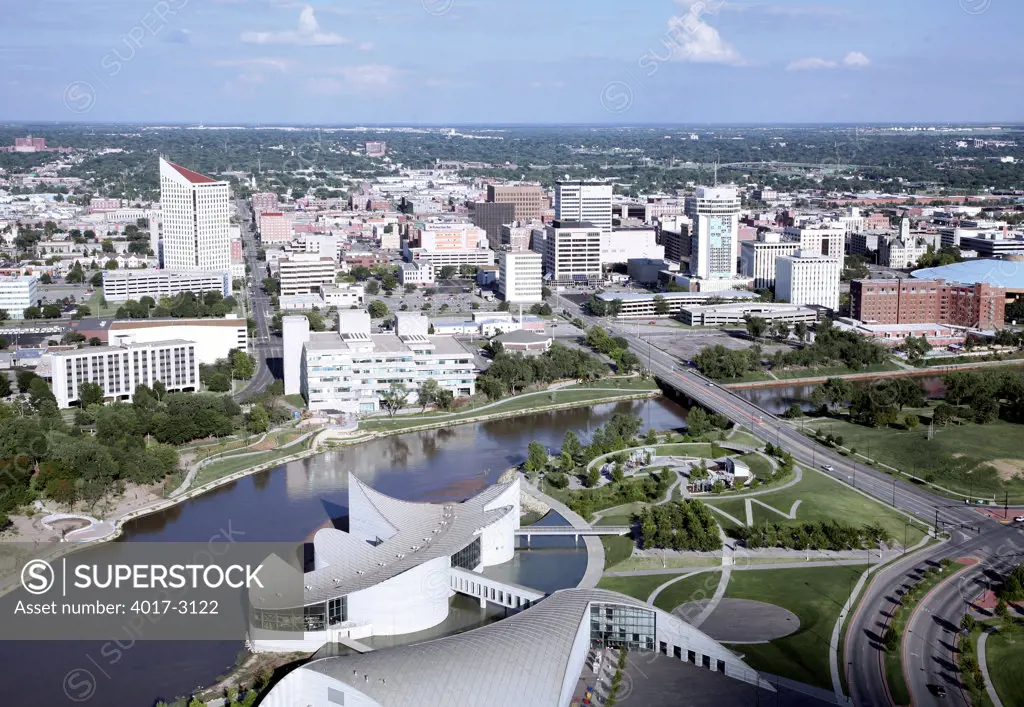 Aerial view of science museum with buildings in a city, Exploration Place, Arkansas River, Wichita, Kansas, USA