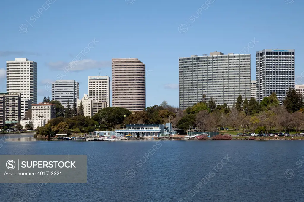 Downtown Skyline of Oakland, California from the waterfront of Lake Merritt with the Lake Merritt Boating Center