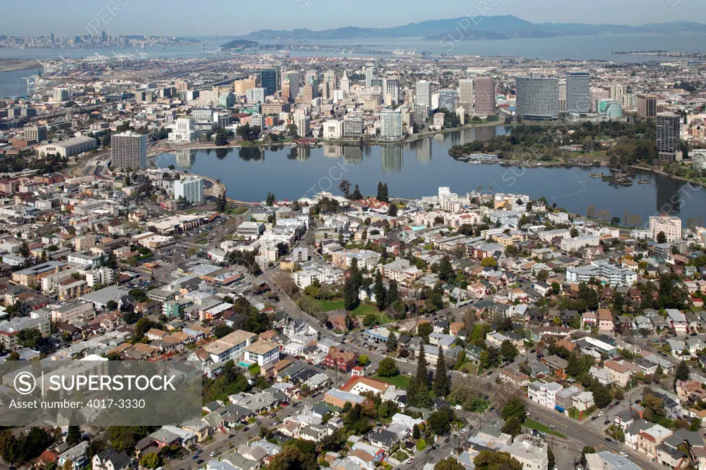 Aerial of Cleveland Heights district and Lake Merritt in Oakland, California with the Downtown Skyline