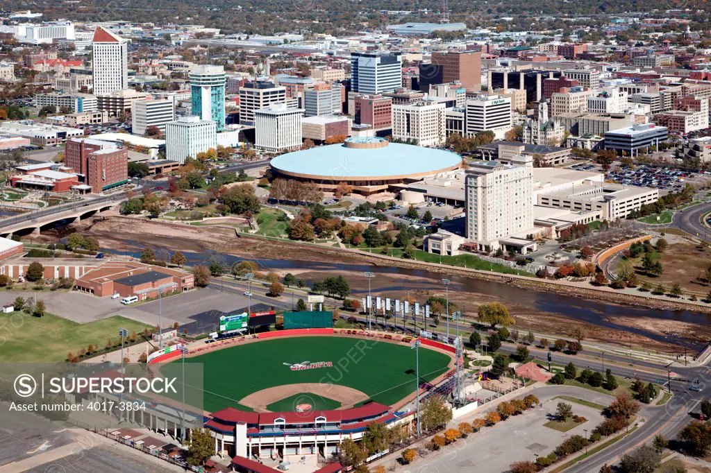 USA, Kansas, Wichita, Aerial of Lawrence-Dumont Stadium with Downtown across Arkansas River
