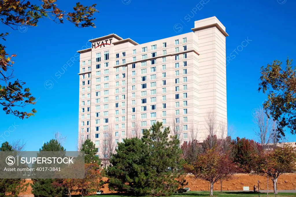 USA, Kansas, Wichita, Hotel framed with fall colored trees