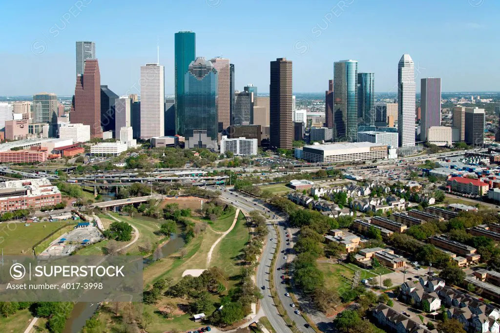 Aerial of the Houston Skyline with the Buffalo Bayou Park, Fourth Ward and Allen Parkway in the foreground