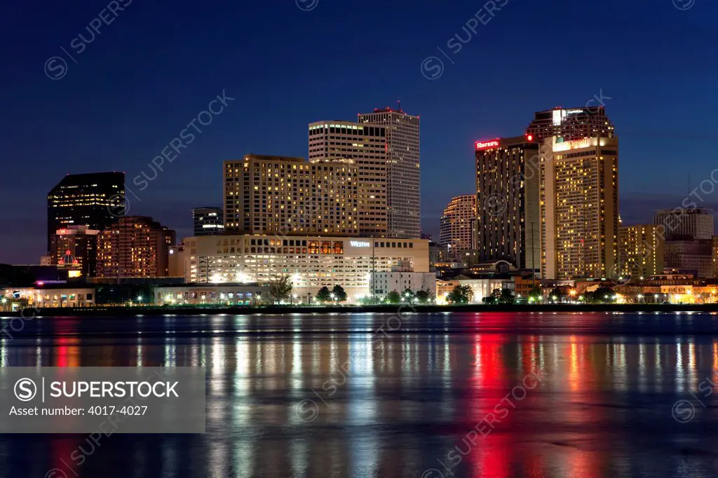 Looking at the New Orleans Skyline at dusk from across the Mississippi River