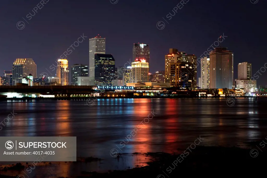Downtown New Orleans, Louisiana at  dusk from across the Mississippi River