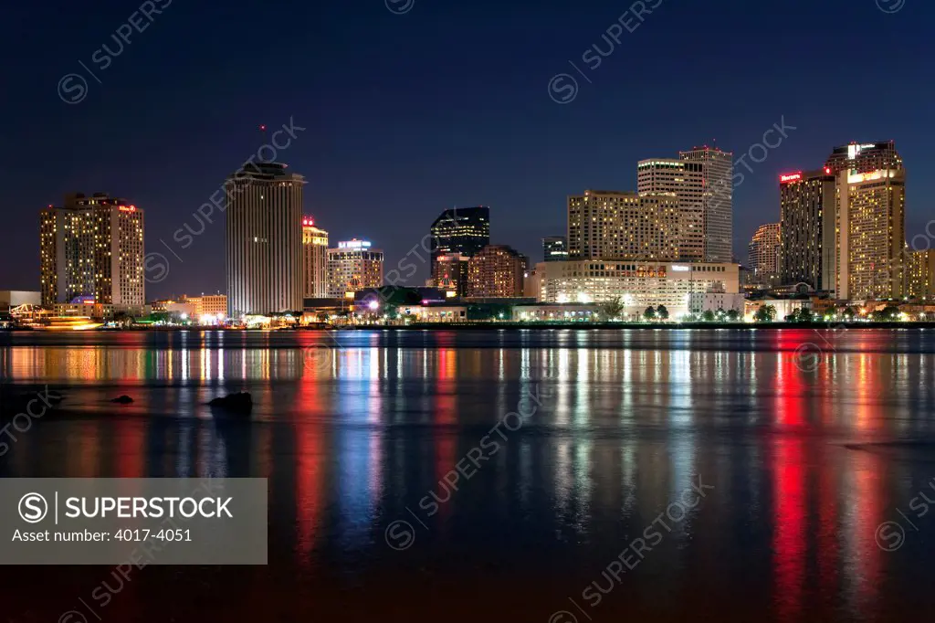 Downtown Skyline of New Orleans, Louisiana at night from across the Mississippi River