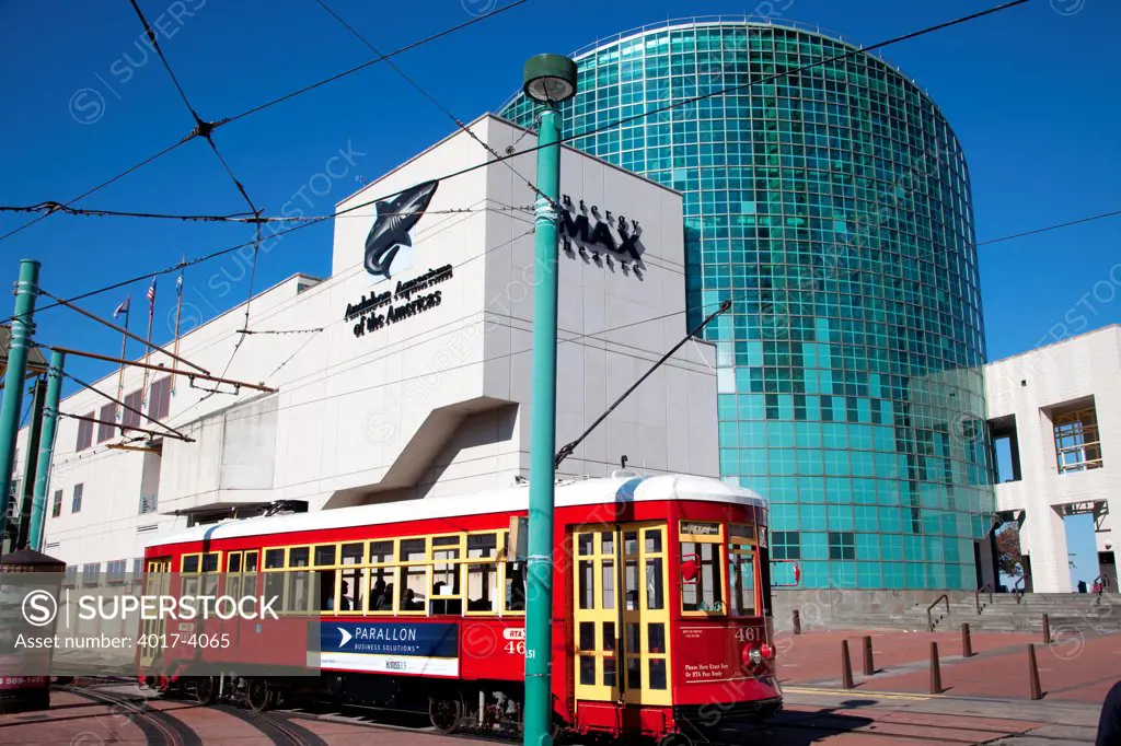 Audubon Aquarium, New Orleans, Louisiana with a street car in the foreground