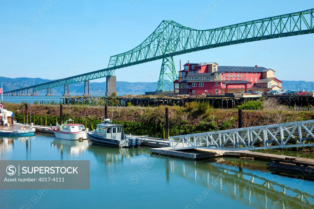 The Astoria bridge old cannery hotel and a small marina