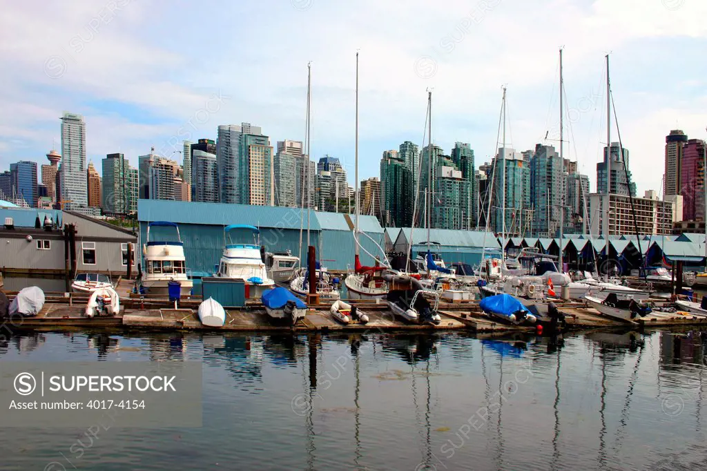 Boats docked at a marina in Coal Harbour, Downtown Vancouver, British Columbia