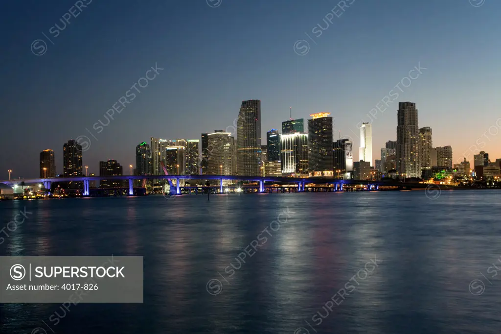 Downtown Miami Skyline and Port Boulevard bridge from Watson Island at dusk