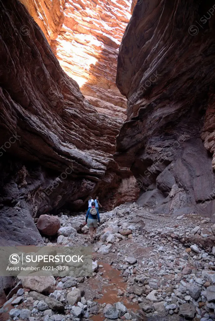 Tourists exploring a slot canyon, Grand Canyon, Arizona, USA