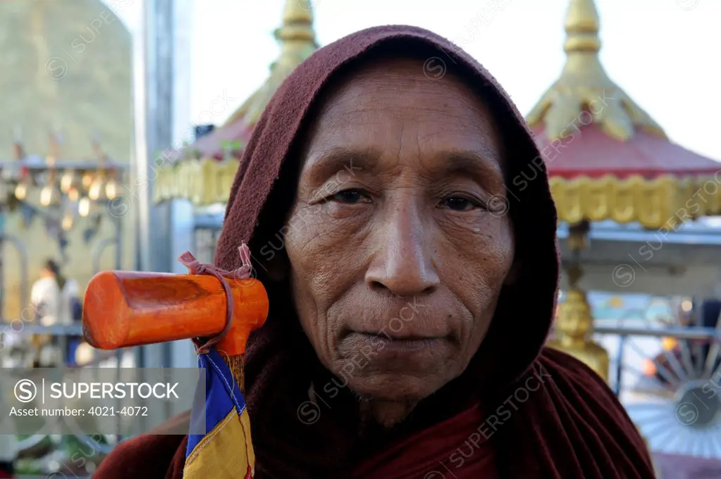 Portrait of a pilgrim at pagoda on the golden rock, Kyaiktiyo Pagoda, Kyaikto, Mon State, Myanmar