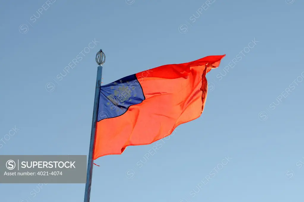 Flag of Myanmar fluttering, Kyaikto, Mon State, Myanmar