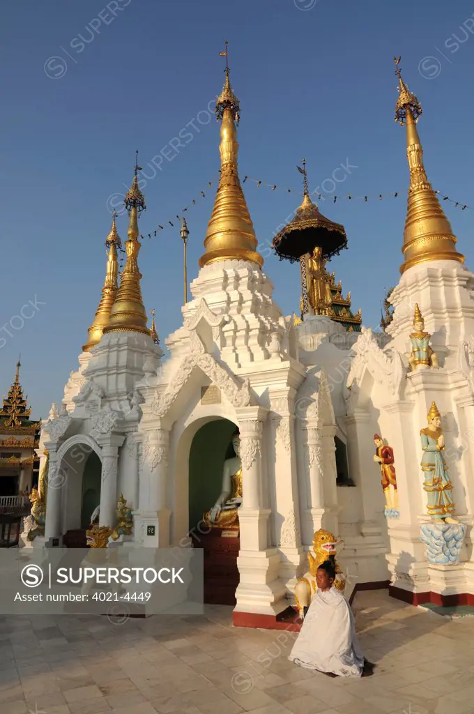 Praying pilgrim in the Shwedagon Pagoda, Yangon, Myanmar