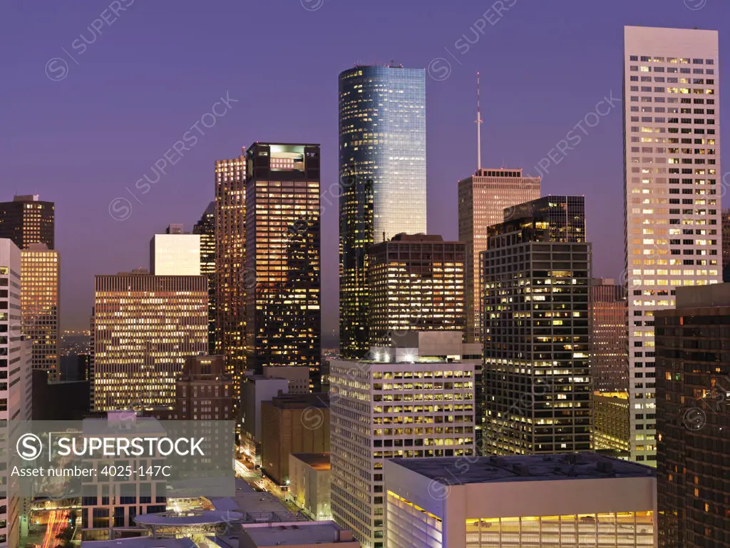 Buildings in a city lit up at dawn, Houston, Texas, USA