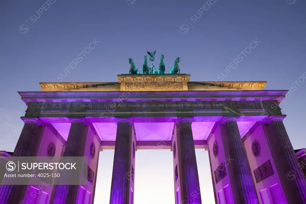 City gate lit up at dusk, Brandenburg Gate, Berlin, Germany