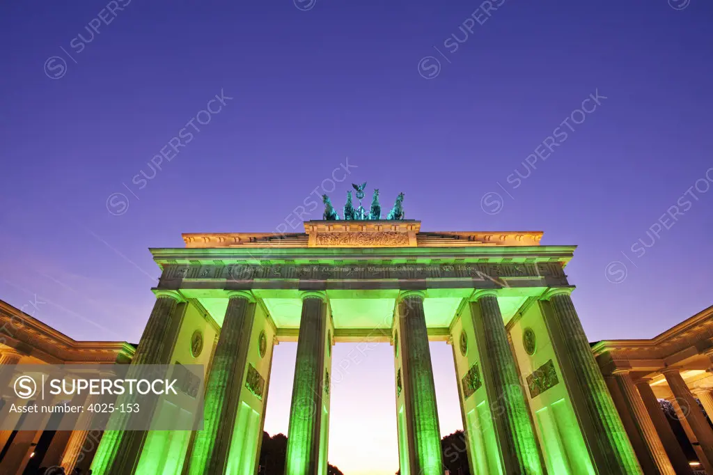City gate lit up at dusk, Brandenburg Gate, Berlin, Germany