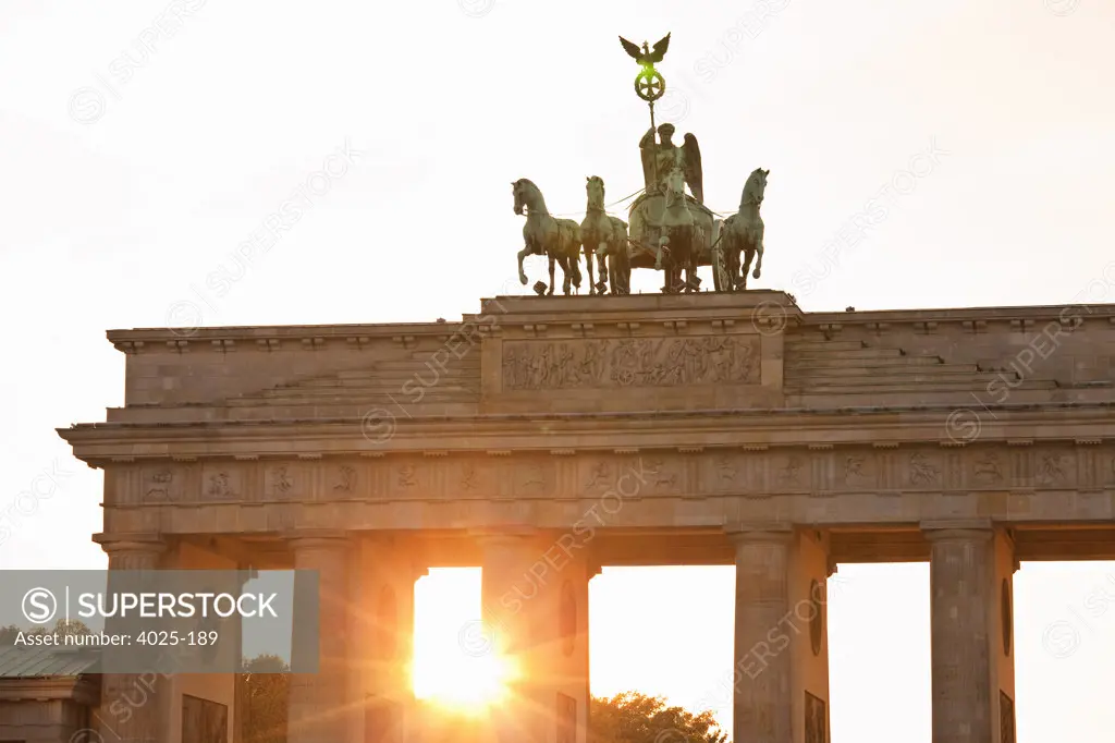 City gate lit up at sunset, Brandenburg Gate, Berlin, Germany